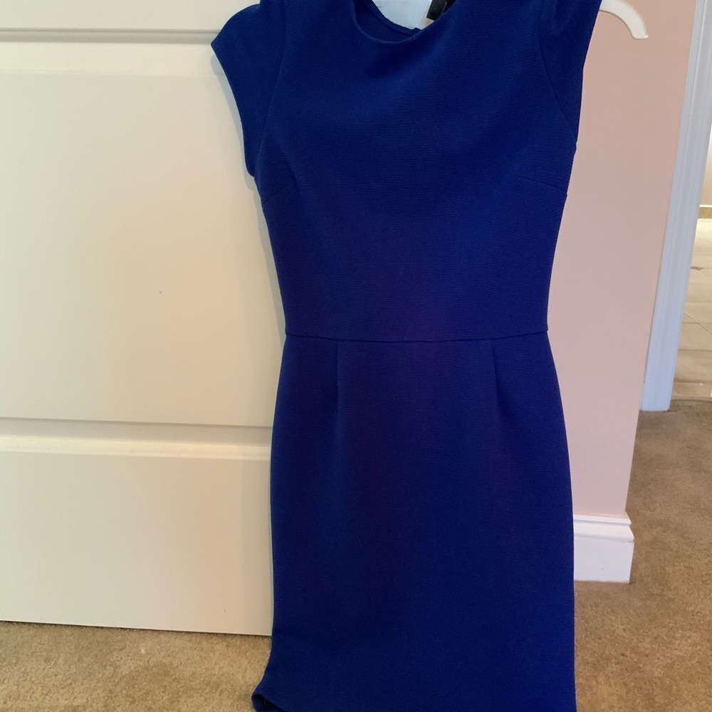 Woman’s aqua dress